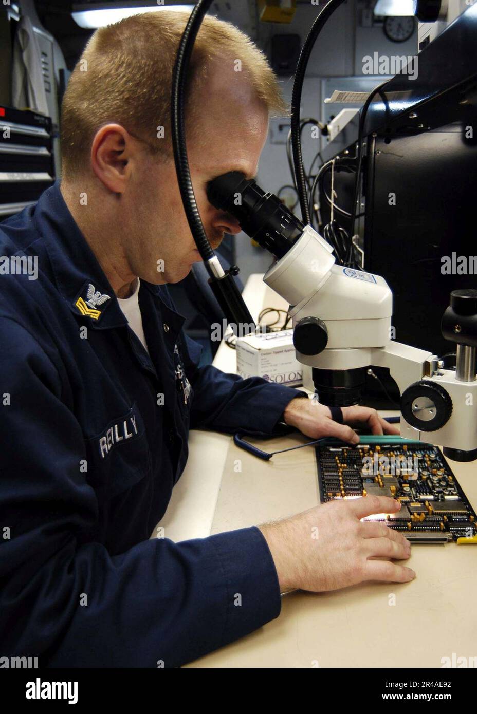 US Navy Aviation Electronics Technician 1st Class inspects a Forward