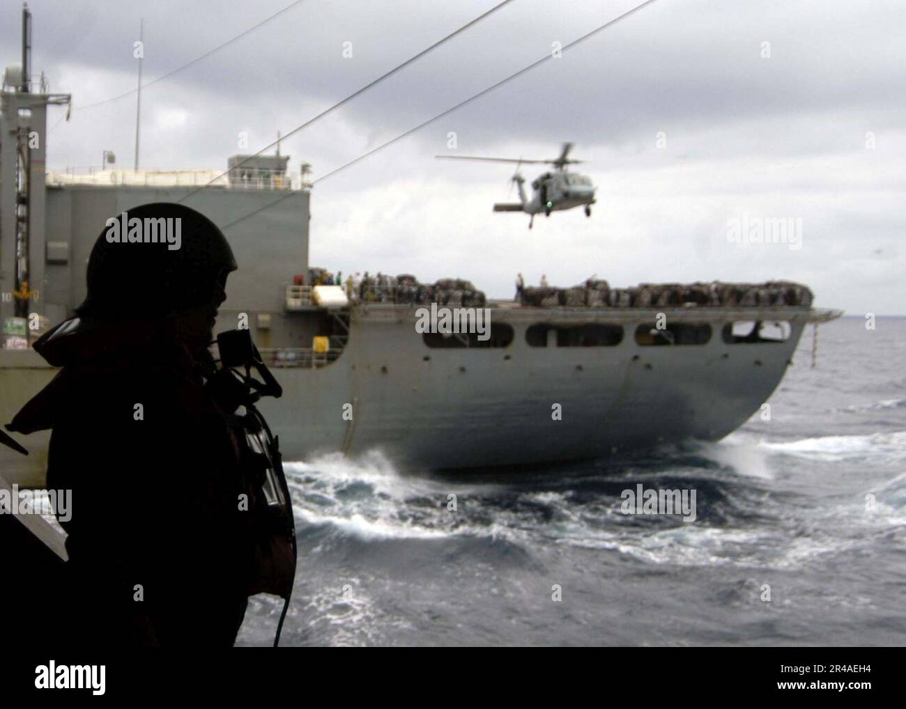 US Navy A Sailor assigned to Deck Department stands the sound powered