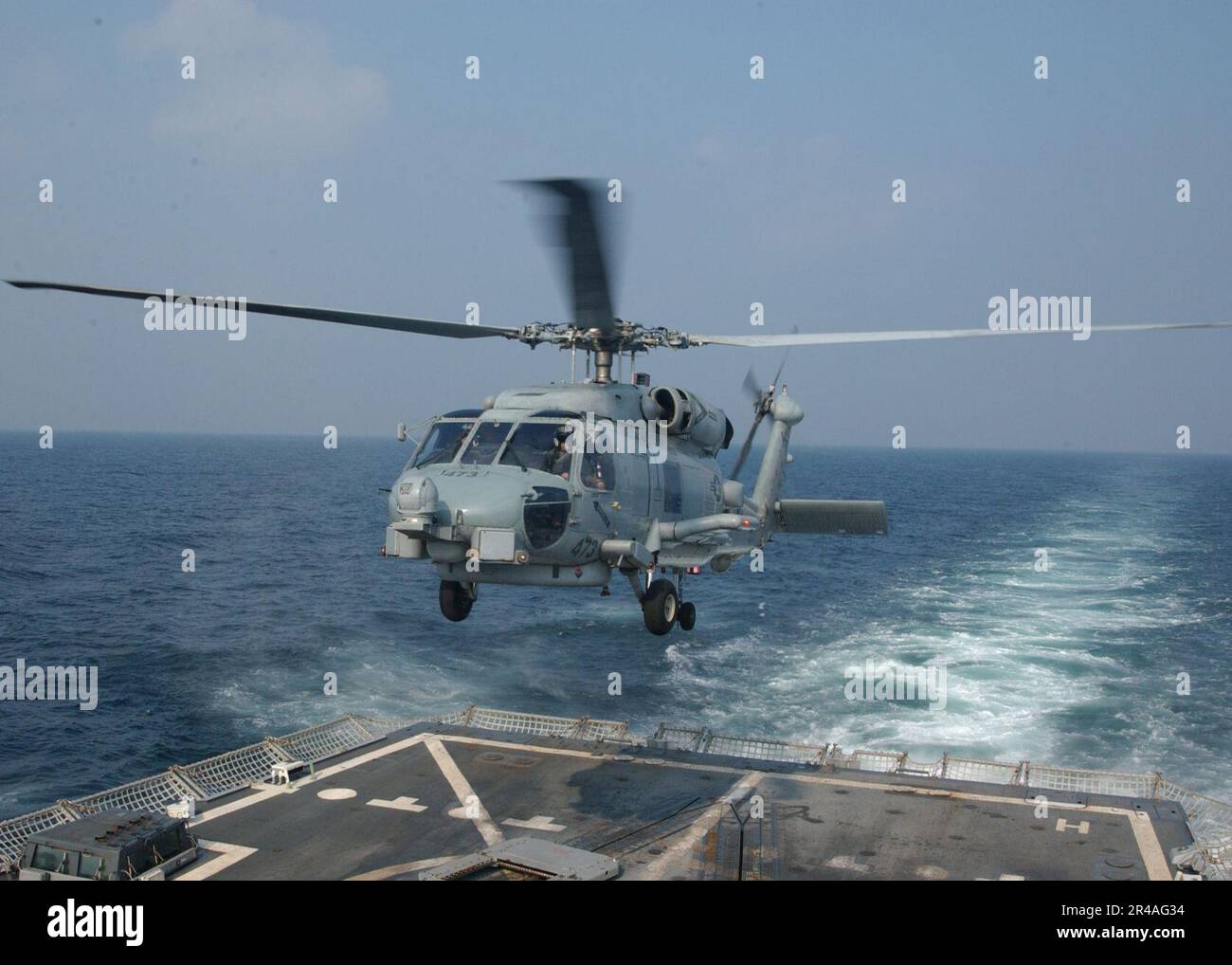US Navy An SH-60B Seahawk helicopter lifts off from the guided missile ...
