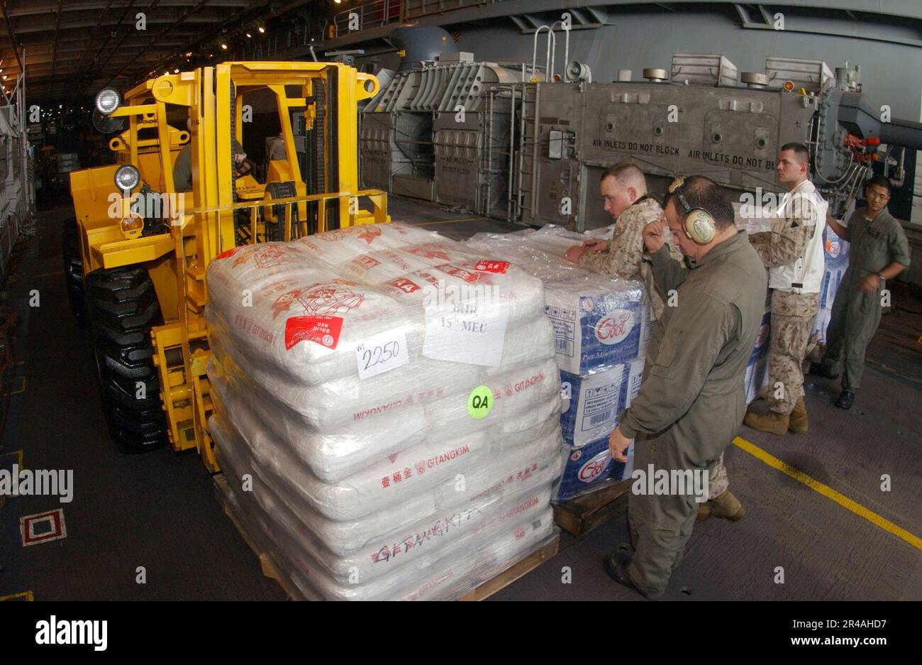 Lcac Loading US Navy U.S. Marines load relief supplies aboard a Landing Craft Air ...