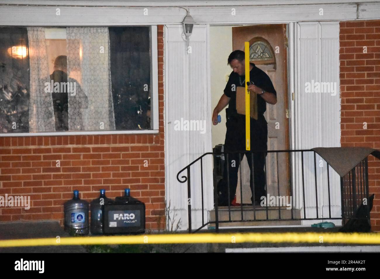 Police officers from the crime scene unit investigate the mass shooting. Mass shooting inside a