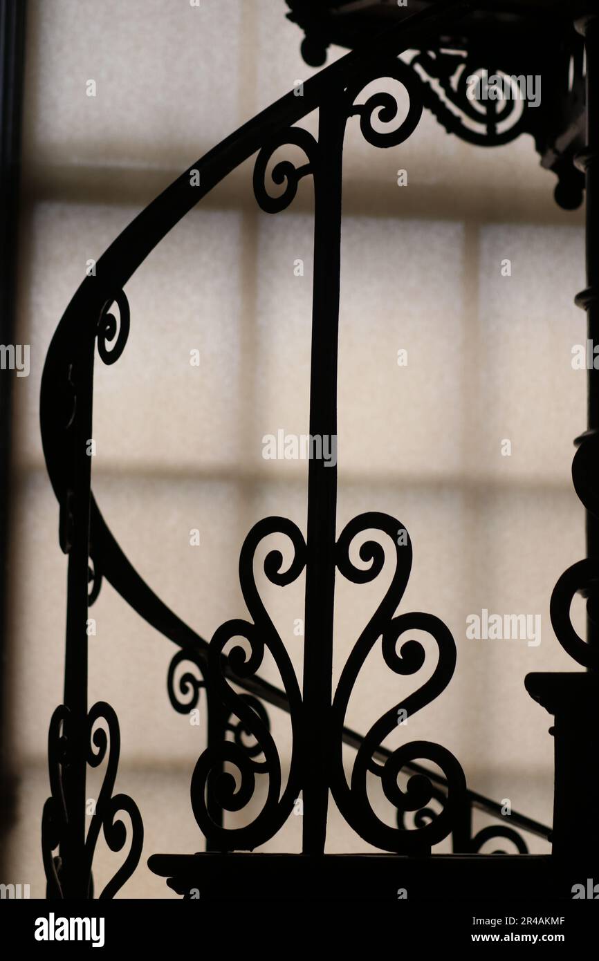 Window Railing Old Type A vintage-style metal railing silhouetted against a bright window Stock ...