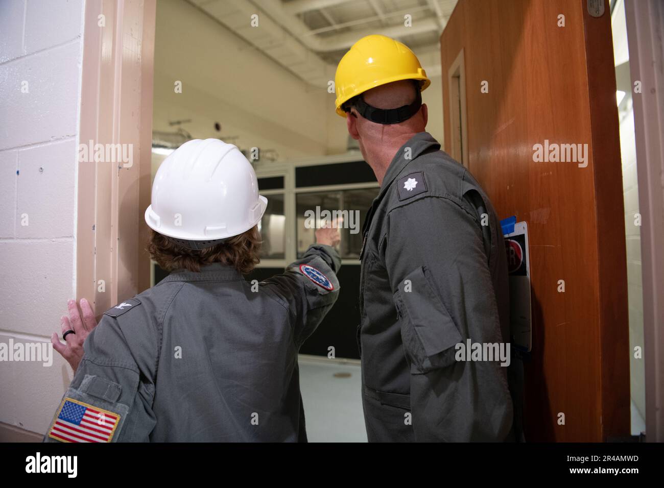 Captain Kimberly Toone, commanding officer Navy Medicine Operational Training Command (NMOTC) (left) tours the renovation project of the ASTC site with CDR Heath Clifford, officer in charge Aviation Survival Training Center Jacksonville (ASTC JAX)(right), Mar. 09, 2023. ASTC JAX is one of eight ASTC training facilities that are encompassed by the Navl Aviation Survival Training Institue (NSTI). NSTI, a detachment of NMOTC, specializes in training the pilots, aircrew, and service members who support other specialized communities in survival skills and technique to survive aviation emergencies. Stock Photo