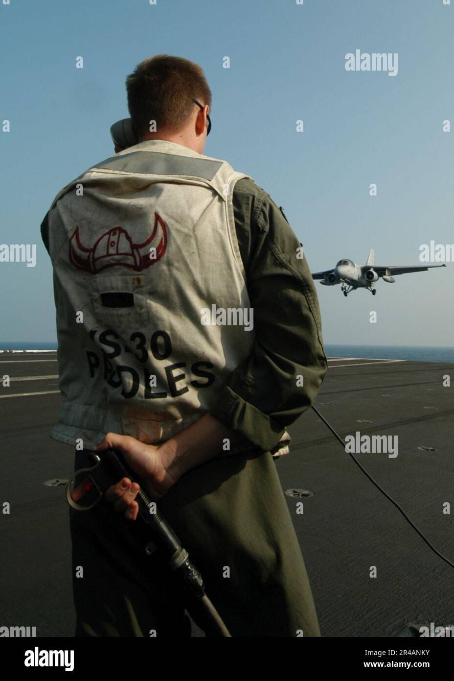 US Navy A Landing Signal Officer (LSO) signals a clear deck Stock Photo