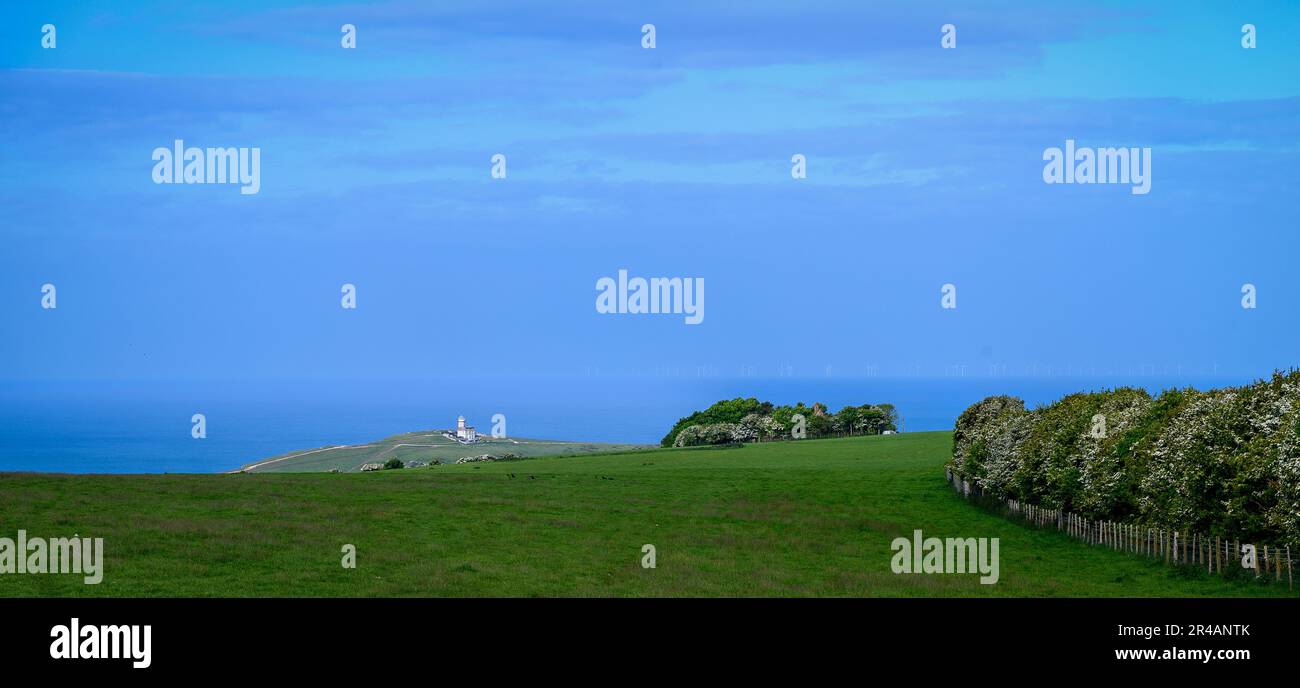 Belle Tout lighthouse from Beachy Head viewed across fields on a sunny day Stock Photo