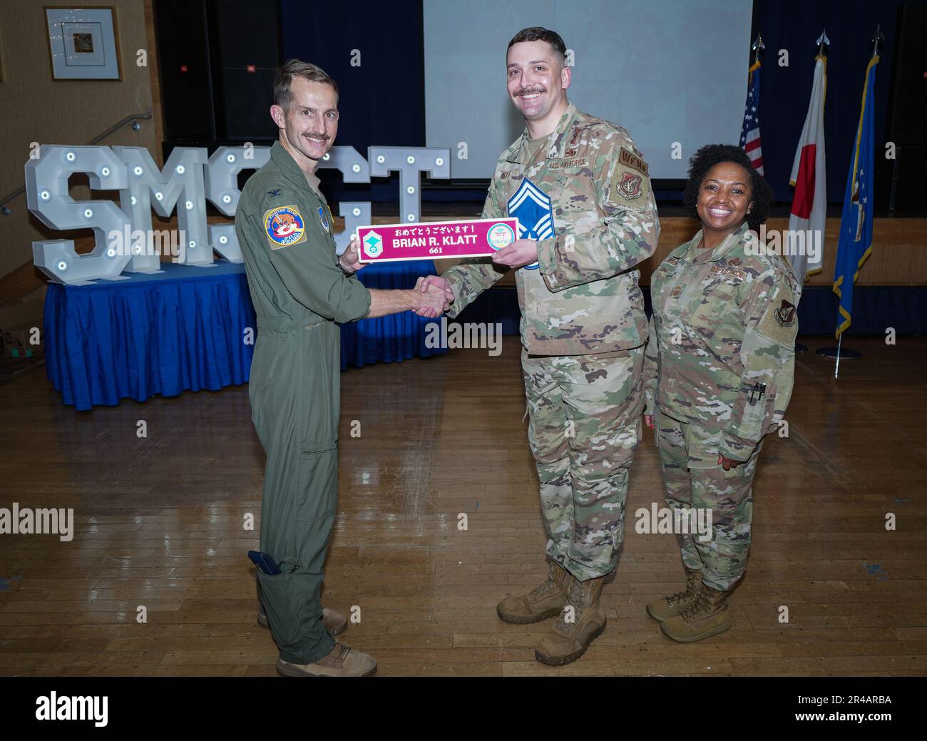 U.S. Air Force Col. Michael P. Richard, 35th Fighter Wing commander, and Chief Master Sgt. Cheronica Blandburg, 35th FW command chief, pose for a photo with Master Sgt. Brian Klatt, 35th Maintenance Squadron, during an E-8 release party at Misawa Air Base, Japan, March 23, 2023. Air Force officials selected 1,629 master sergeants for promotion to senior master sergeant, out of 16,031 eligible, for a selection rate of 10.16 percent in the 23 E8 promotion cycle. Stock Photo