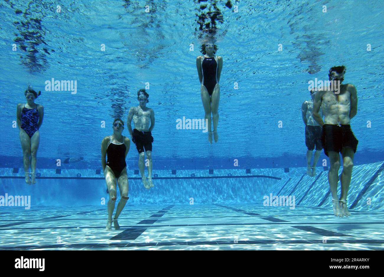 US Navy  U.S. Olympic Team triathletes perform down proofing exercises in the pool during a day of training with Navy SEALs (Sea, Air, Land) on board Naval Special Warfare Center, San Diego, Calif. Stock Photo