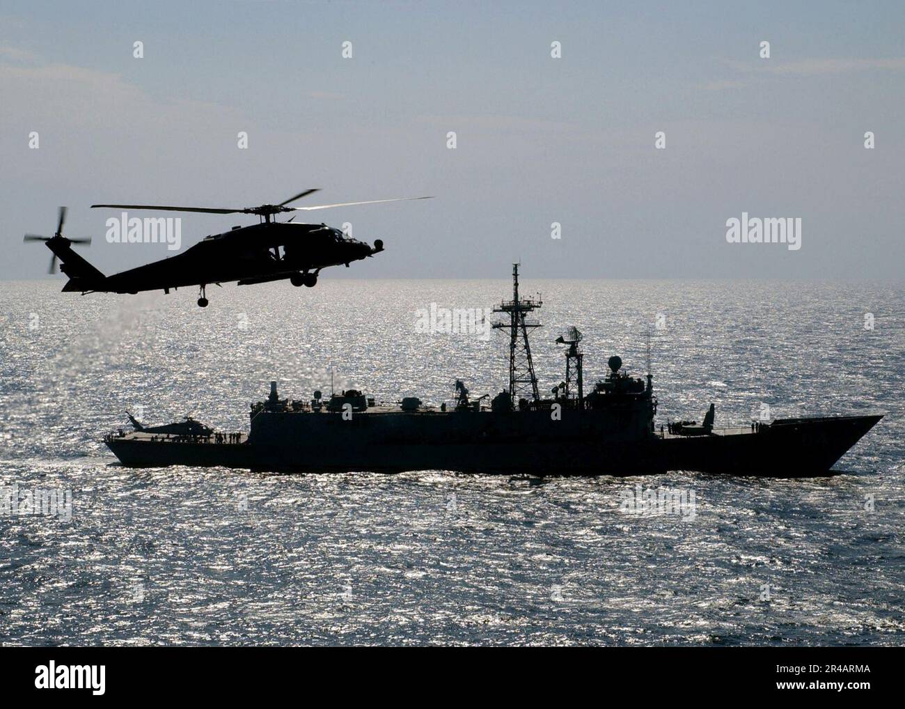 US Navy An HH-60H Seahawk hovers near the Royal Australian Navy frigate ...