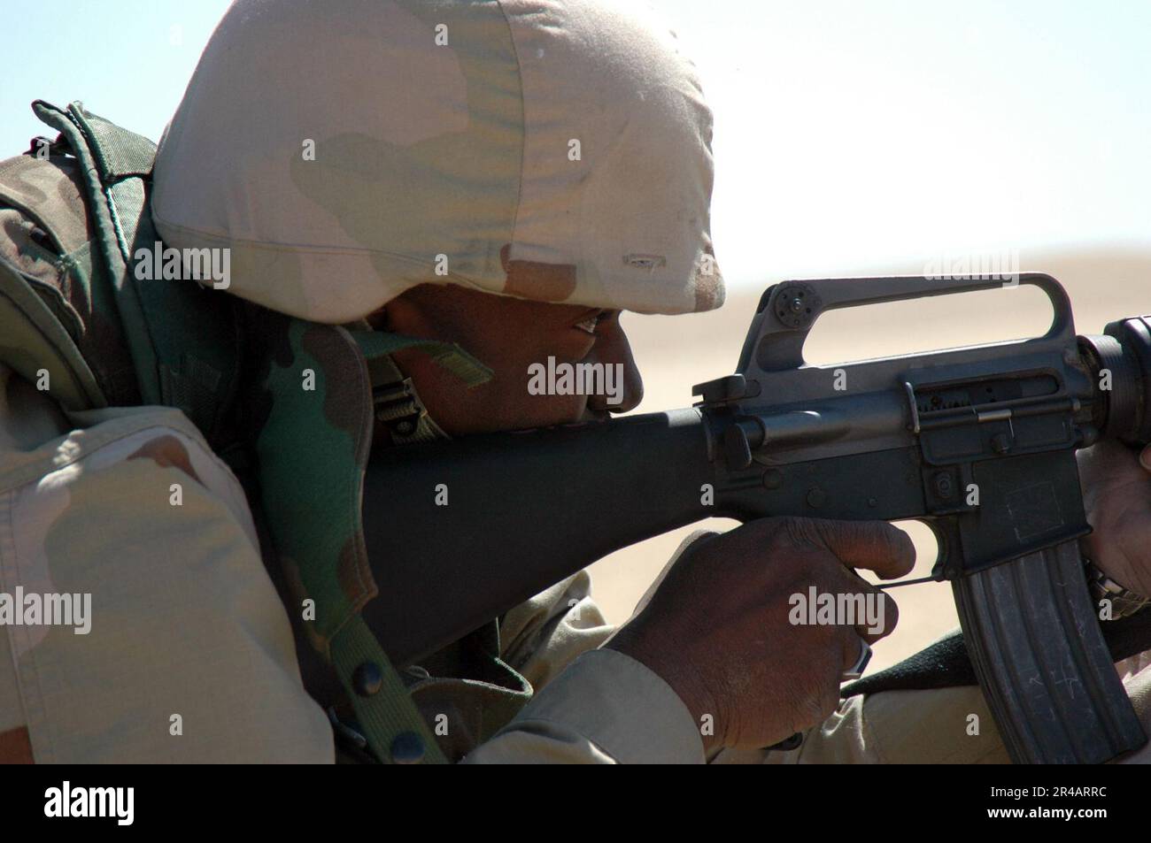 US Navy Electronics Technician 3rd Class hones his shooting skills on