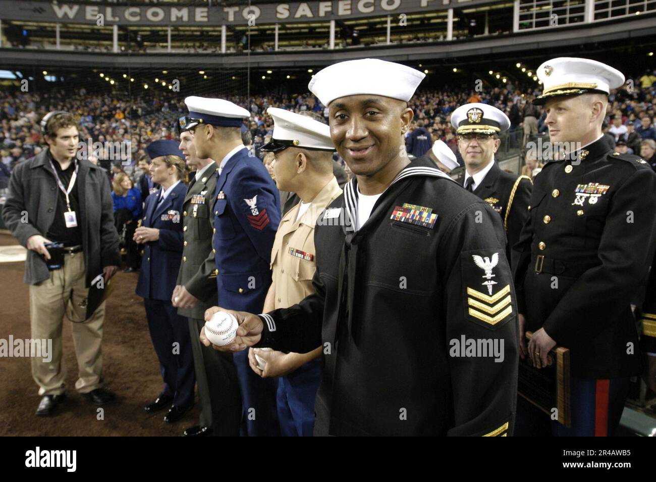 US Navy Hospital Corpsman 1st Class assigned to Naval Hospital Bremerton, Wash., prepares to take the field to throw the first pitch during the Boeing Salute to Armed Forces Night at SAF Stock Photo