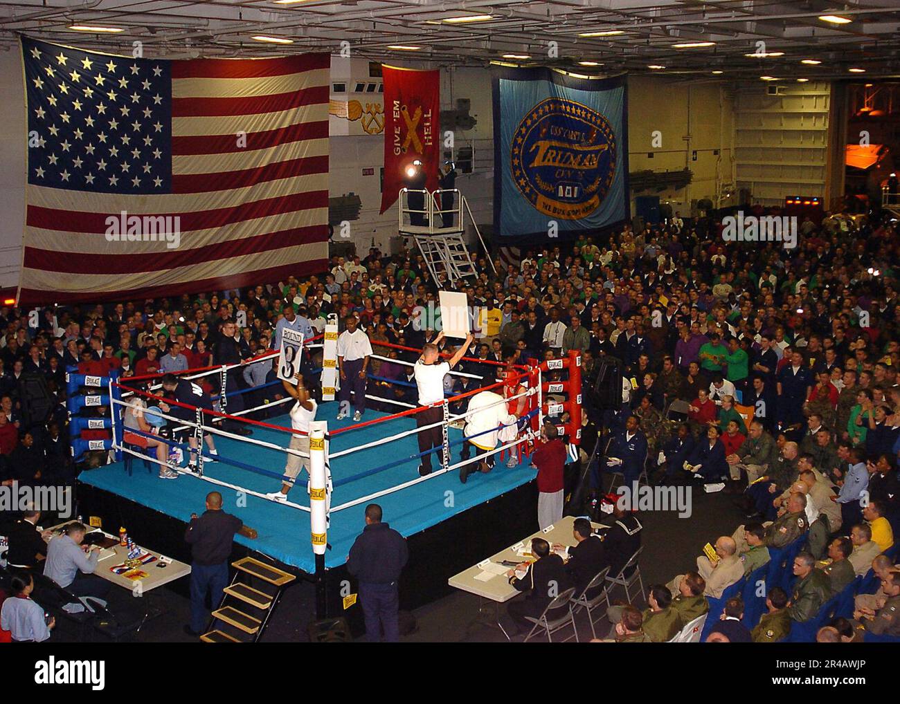 US Navy A crowd of over 3000 Sailors and Marines pack the hangar bay while watching the first