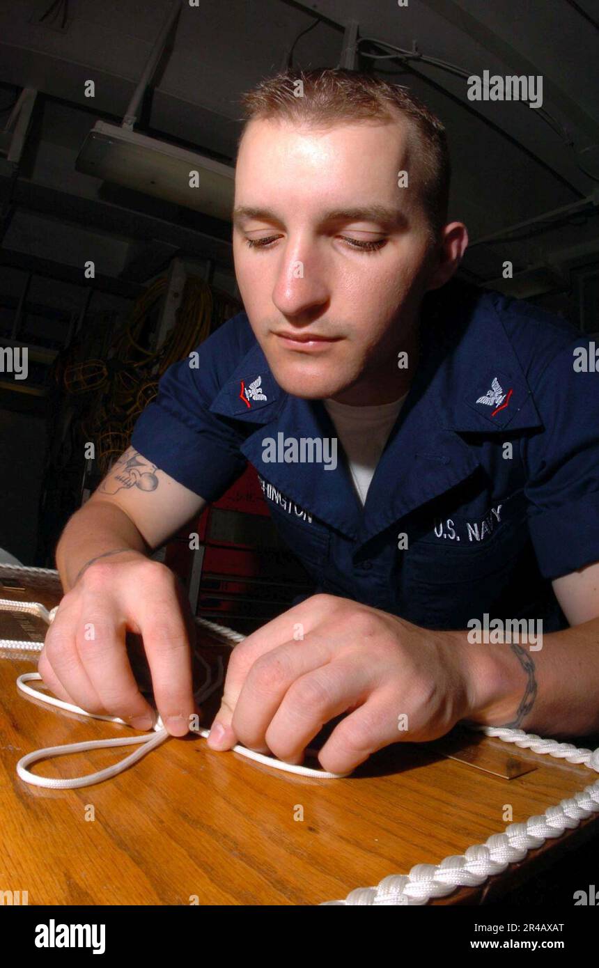 US Navy Boatswain's Mate 3rd Class prepares a Stock Photo Alamy