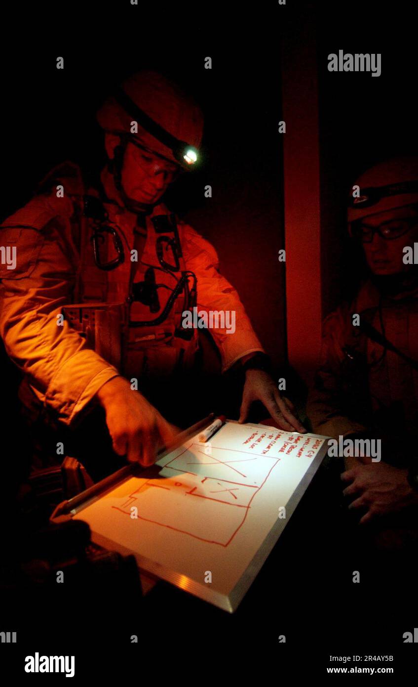 Chief Electronics US Navy Chief Electronics Technician explains the layout of a building ...