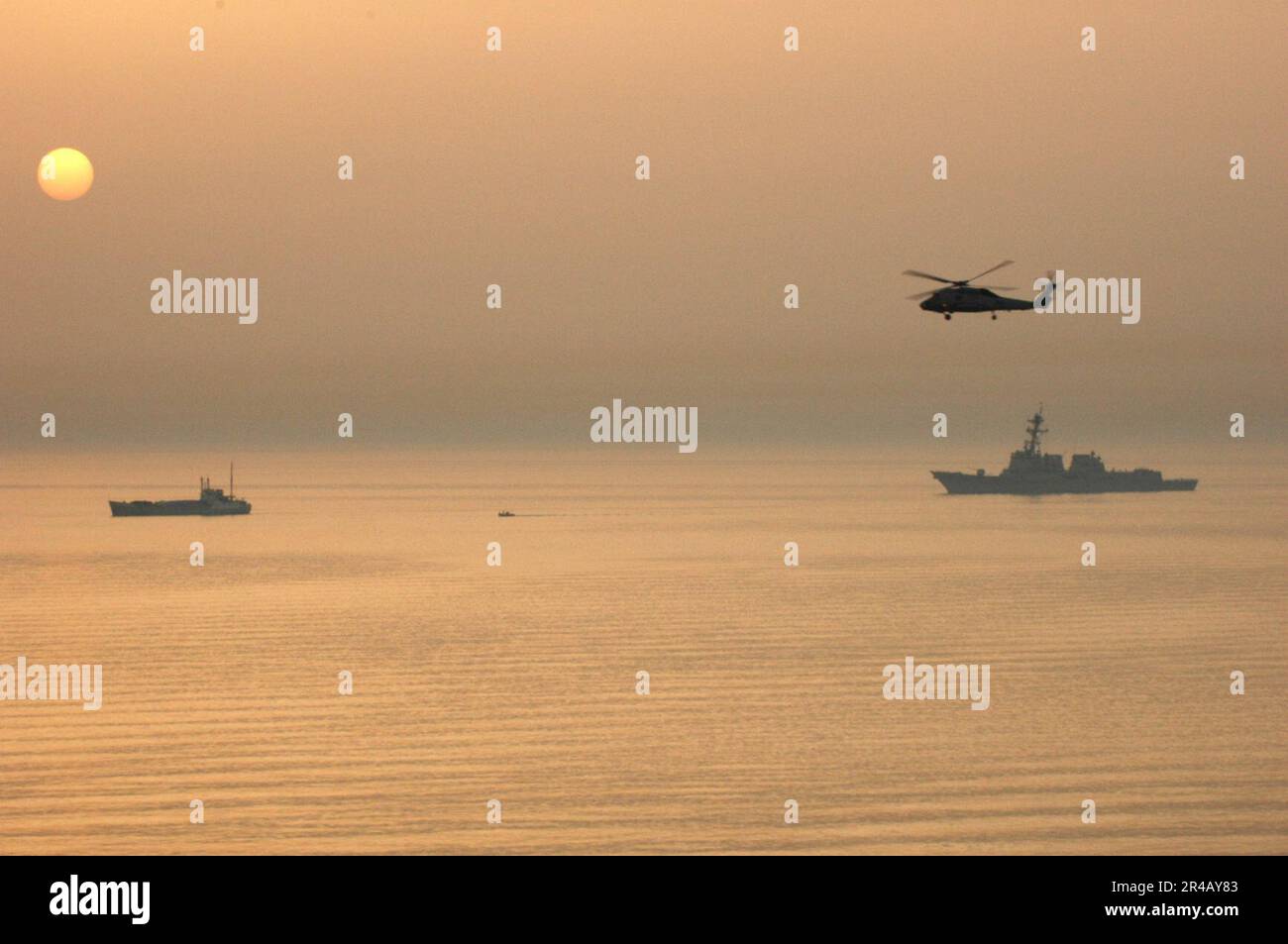 US Navy Rigid Hull Inflatable Boats (RHIB) attached to the guided ...