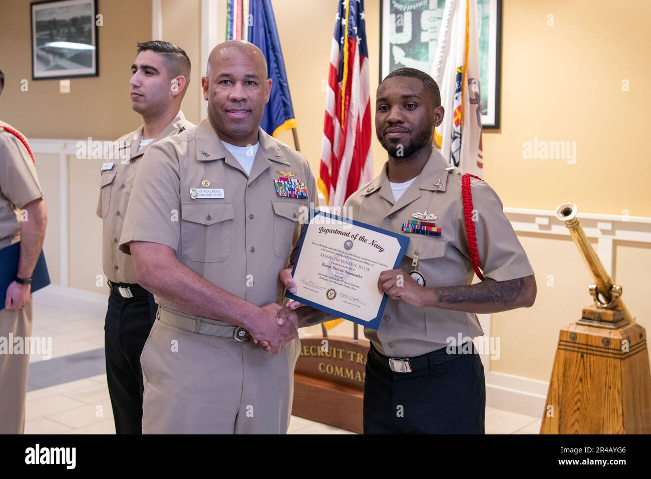 Sailors receive certificates during Recruit Division Commander 'C' School graduation. More than 40,000 recruits train annually at the Navy's only boot camp. Stock Photo