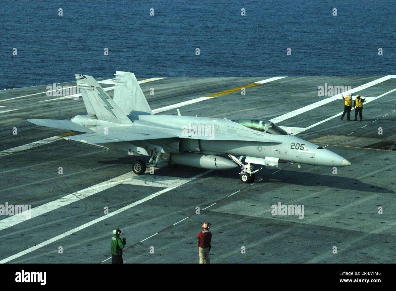 US Navy An F-A-18C Hornet taxies after landing aboard the flight deck ...