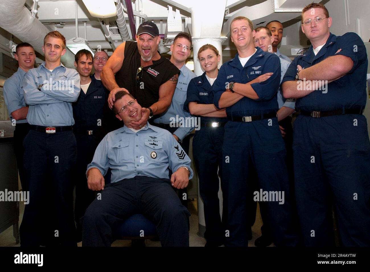 US Navy  Professional wrestling champion and actor Bill Goldberg takes a moment to pose with the photographers of Operations Department's OP Division during his tour of USS Ronald Reagan (CVN 76). Stock Photo