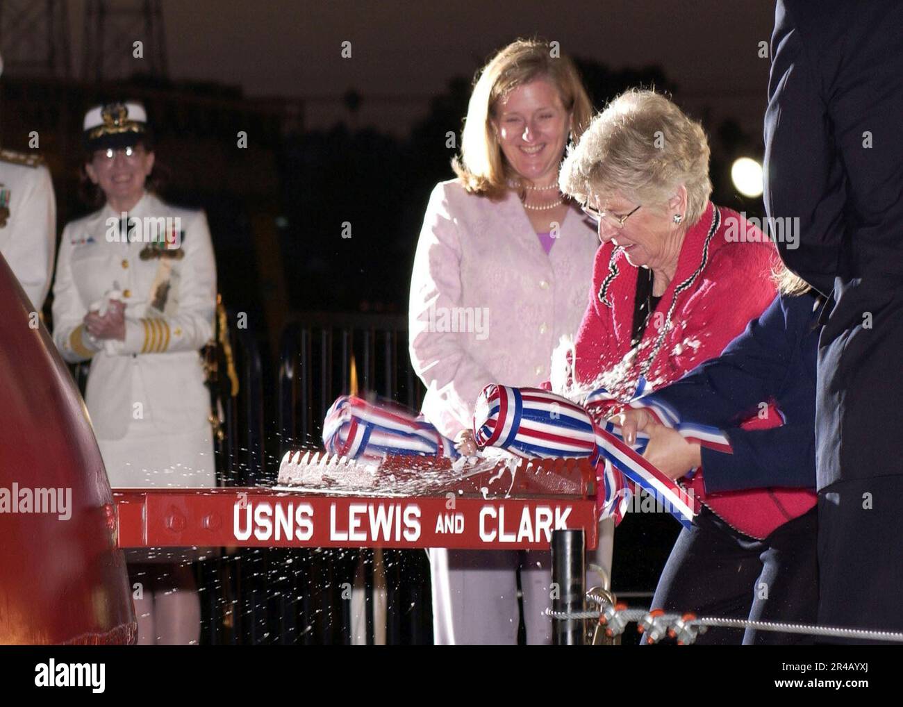 US Navy  Ship sponsors, Mrs. Jane Lewis Sale Henley and Ms. Lisa Clark, christen the Military Sealift Command (MSC) auxiliary dry cargo carrier USNS Lewis and Clark, (T-AKE 1). Stock Photo