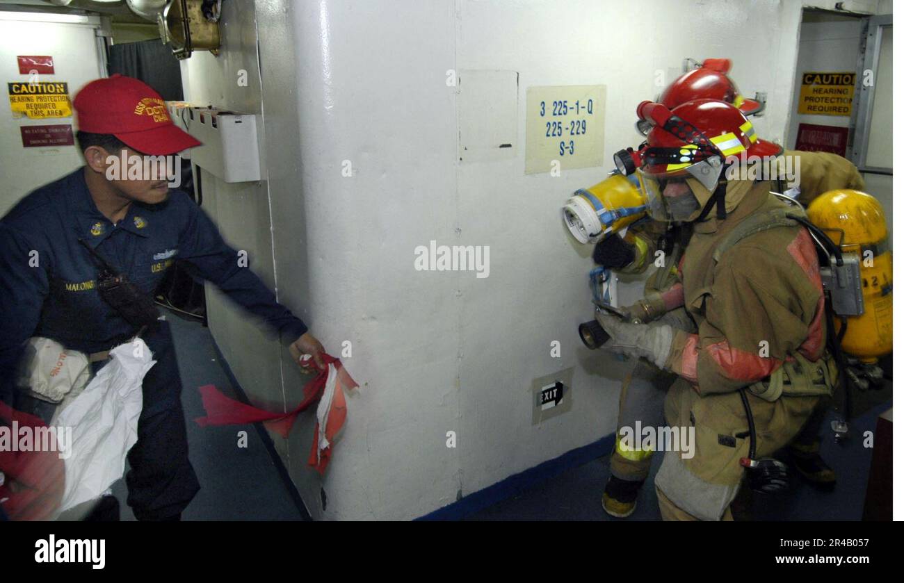 US Navy Chief Storekeeper provides firefighting training to members of