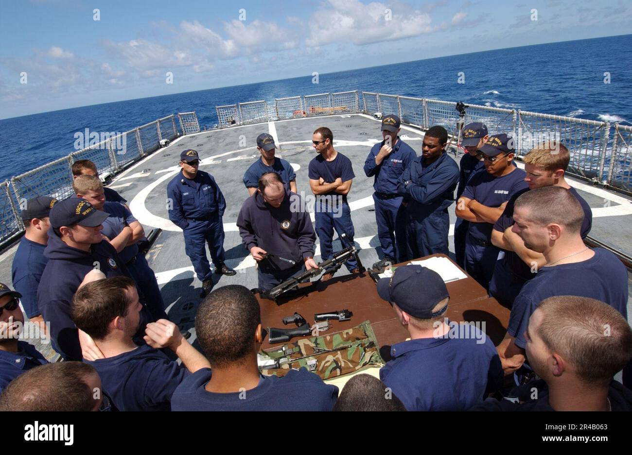 US Navy Gunner's Mate 1st Class trains crew members of the Coast Guard