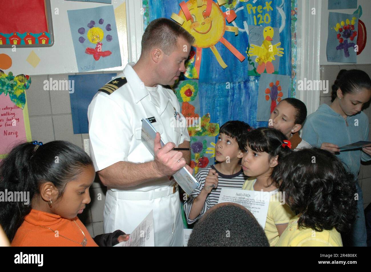 US Navy  Lt. Cmdr. speaks to children of the Jacob Blackwell After School Program in Queens, New York. Stock Photo