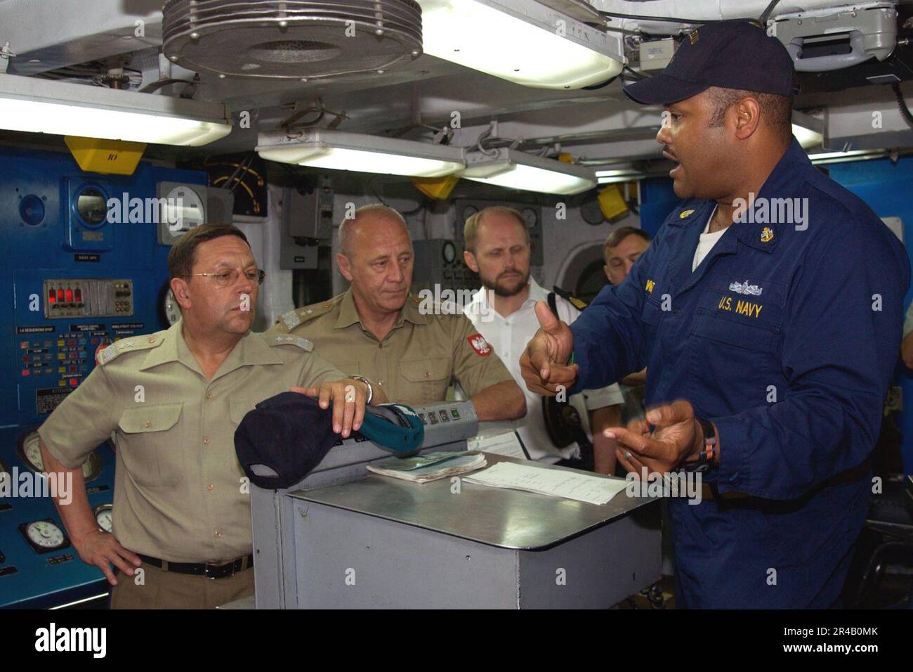 US Navy Chief Machinist's Mate gives a tour of the Main Machinery Room ...