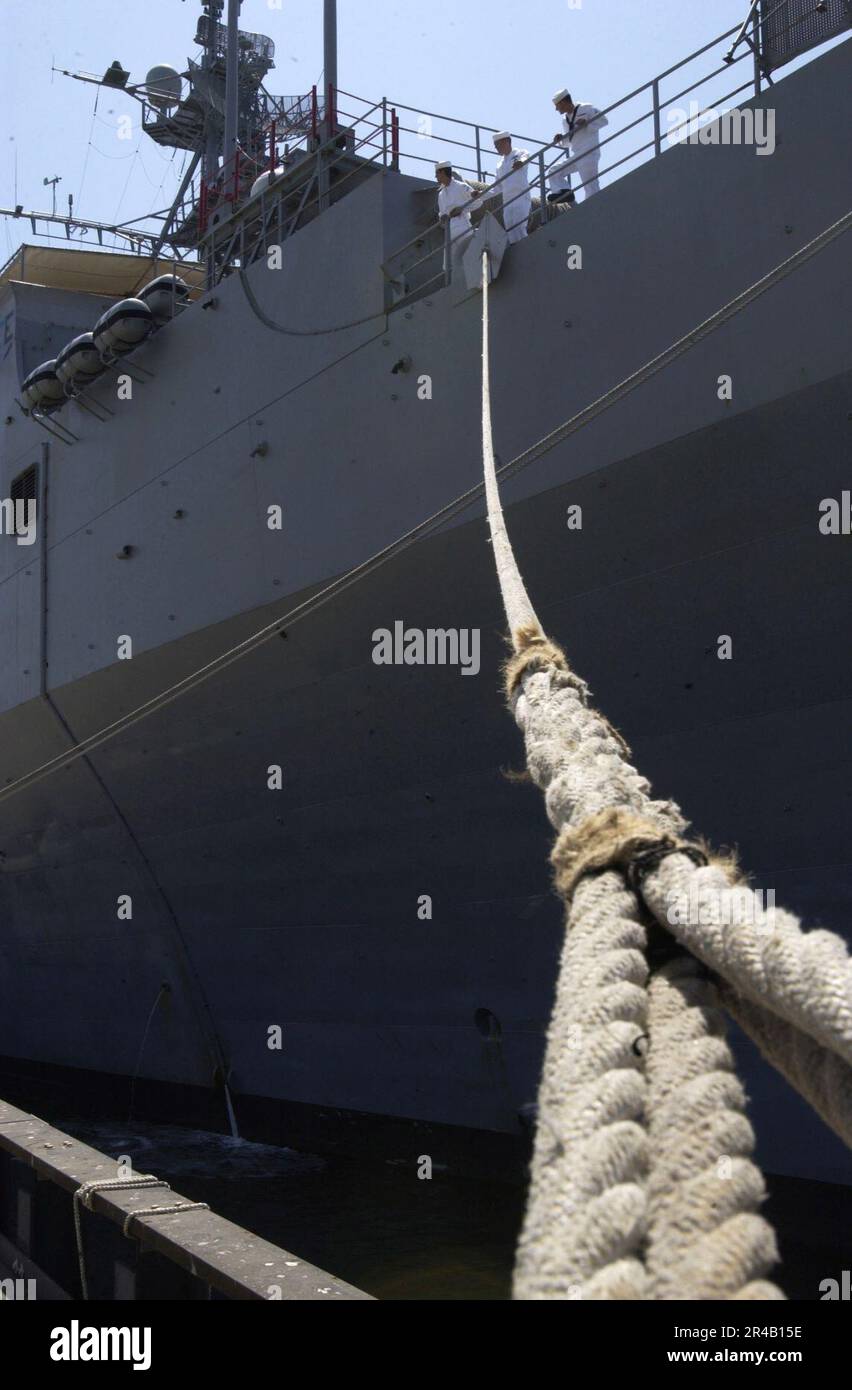 US Navy Sailors mantherails as the amphibious dock landing ship USS Duluth (LPD 6) return
