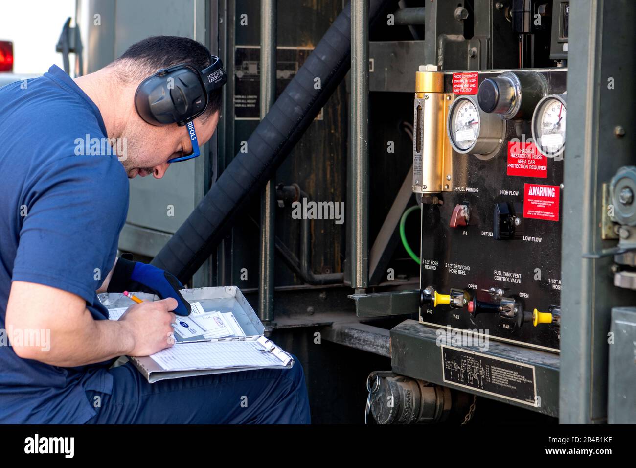 Julio Correa, 502nd Logistics Readiness Squadron fuel system operator, logs fuel prior to the transfer of fuel from an R-11 refueler truck into a waiting aircraft that was moving humanitarian cargo from Joint Base San Antonio-Lackland, Texas to Incirlik AB, Turkey in support of emergency disaster relief efforts Feb. 21, 2023. The tanker truck holds a maximum capacity of 23,000 liters and are able to transfer fuel at a rate of approximate 2,300 liters per minute. Stock Photo