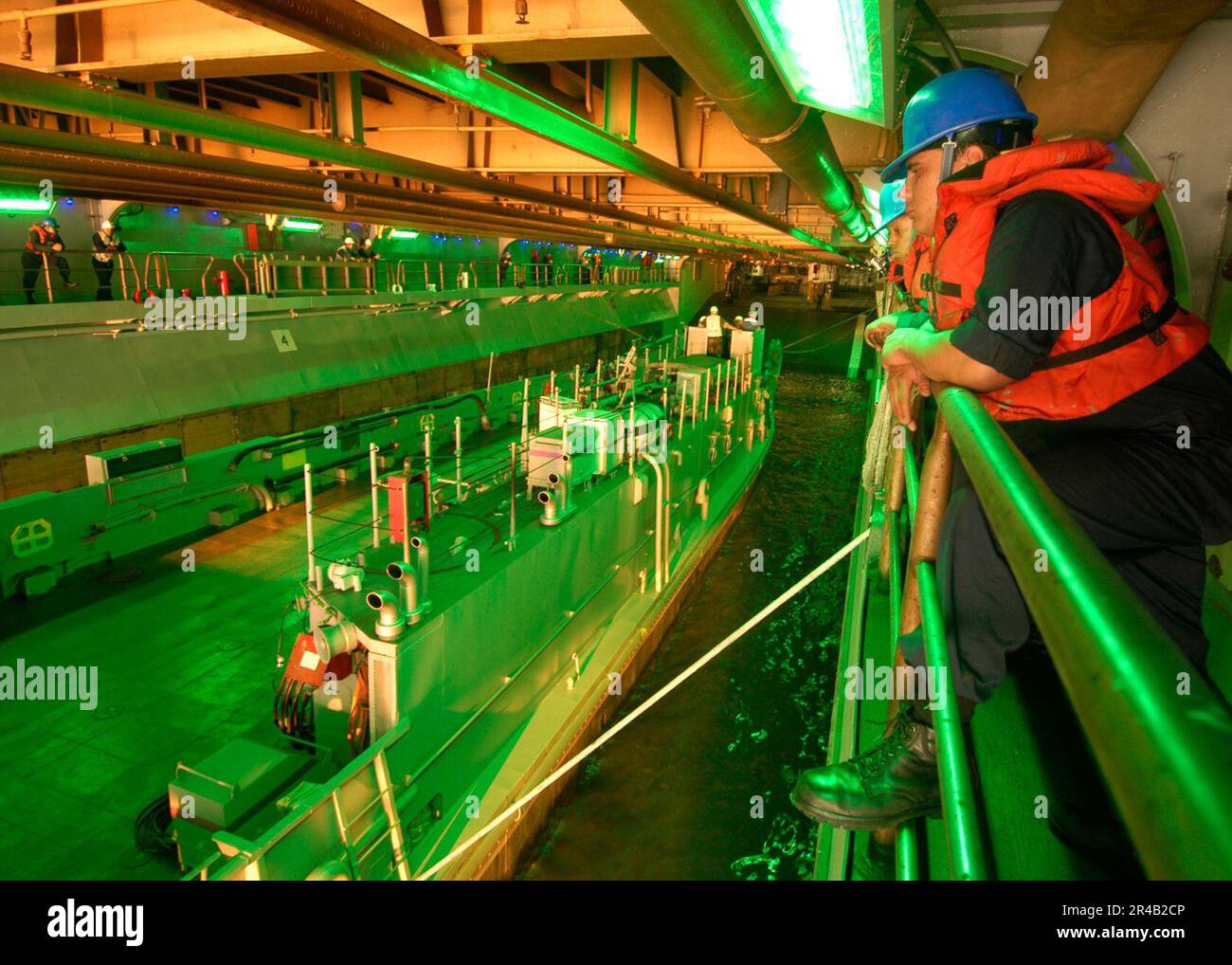 US Navy Boatswain's Mate 3rd Class rests for a moment during the
