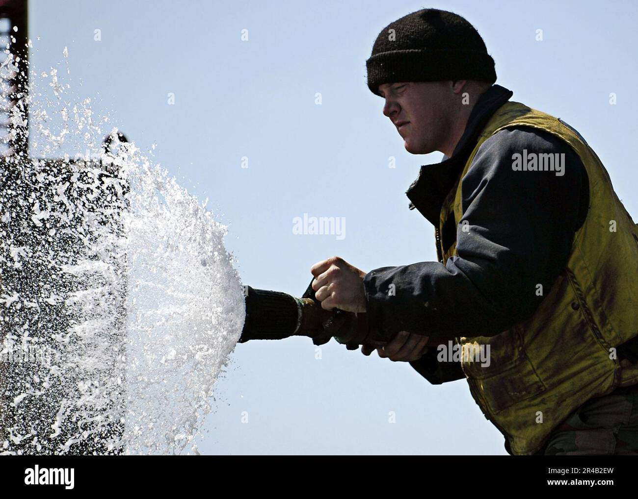 US Navy A Sailor assigned to Air Department slowly opens the vari