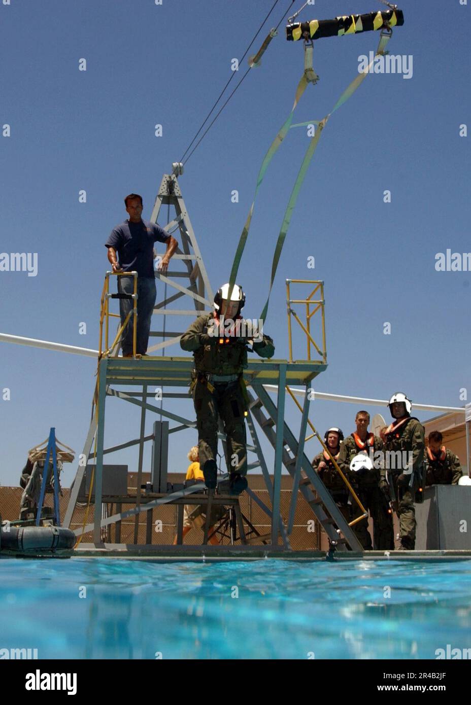 US Navy  A student attending the refresher course in water survival at Aviation Survival Training Center, Marine Corps Air Station Miramar, prepares to enter the water. Stock Photo