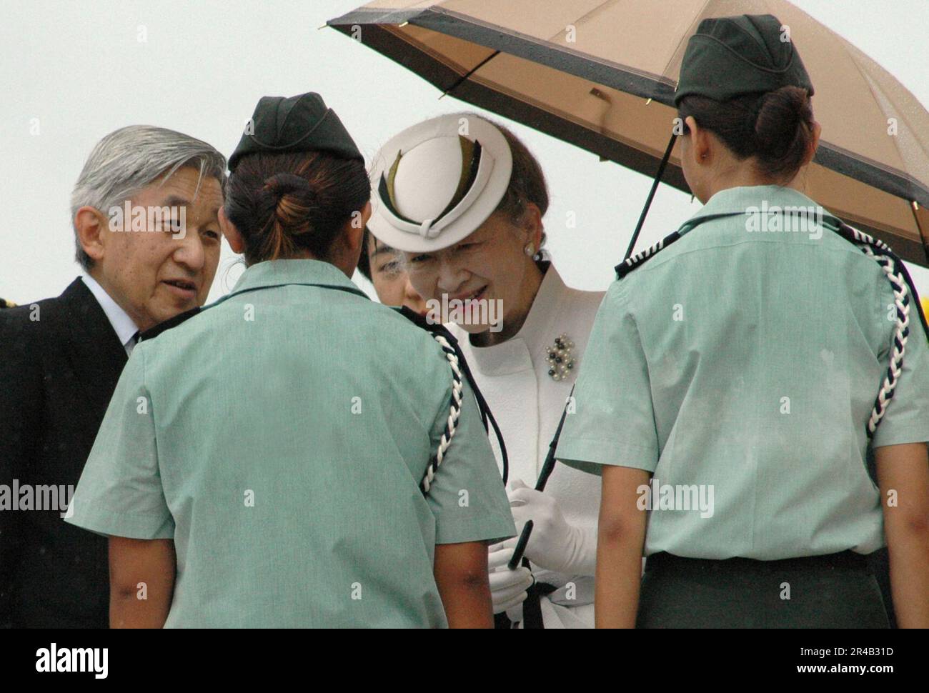 US Navy Japanese Emperor Akihito and Empress Michiko take a moment to talk with U.S. Army Junior Reserve Officer Training Corps (ROTC) Cadet Lt. and Cadet Sgt. Major Stock Photo