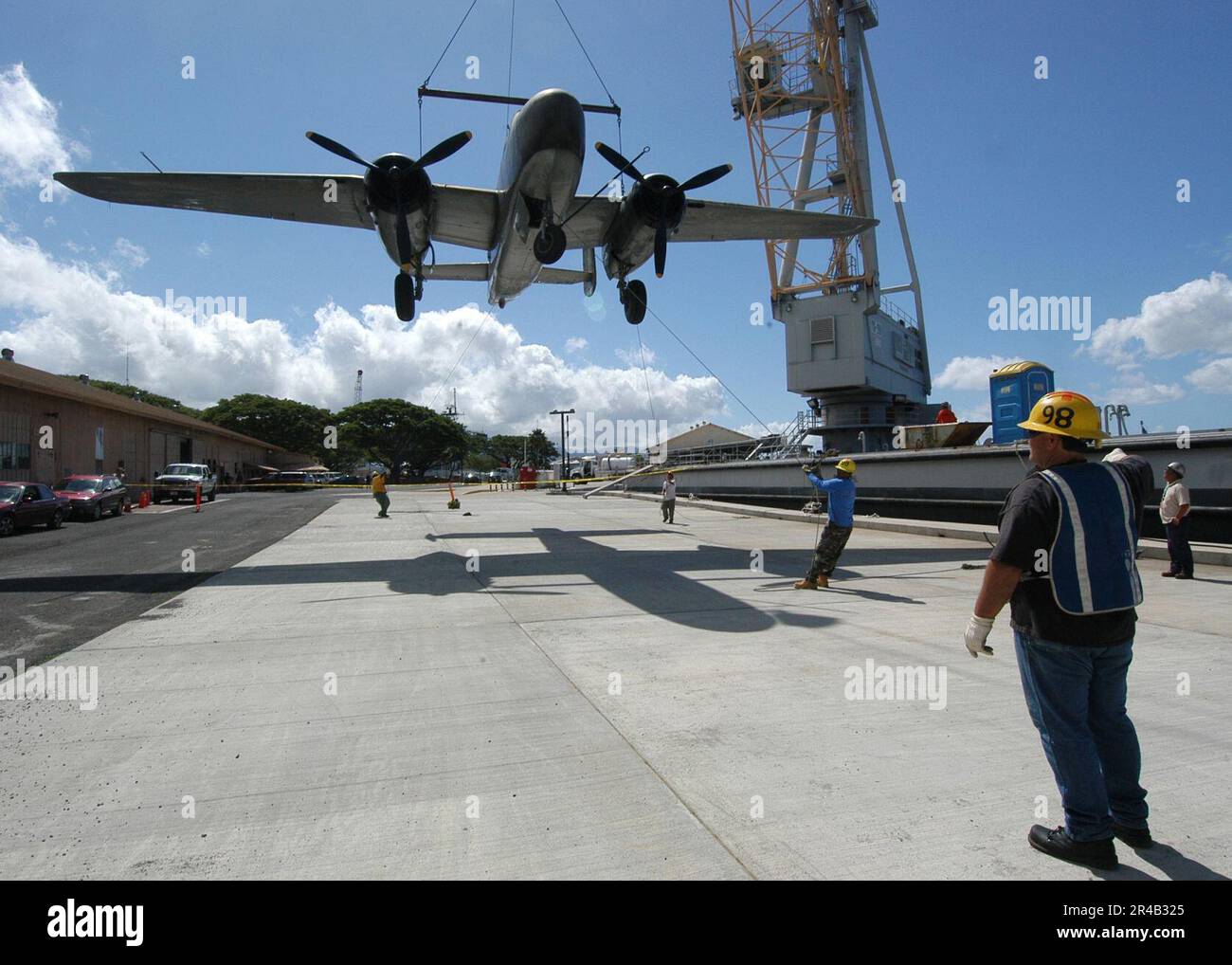 US Navy A line handler directs as a World War IIvintage B25 Mitchell