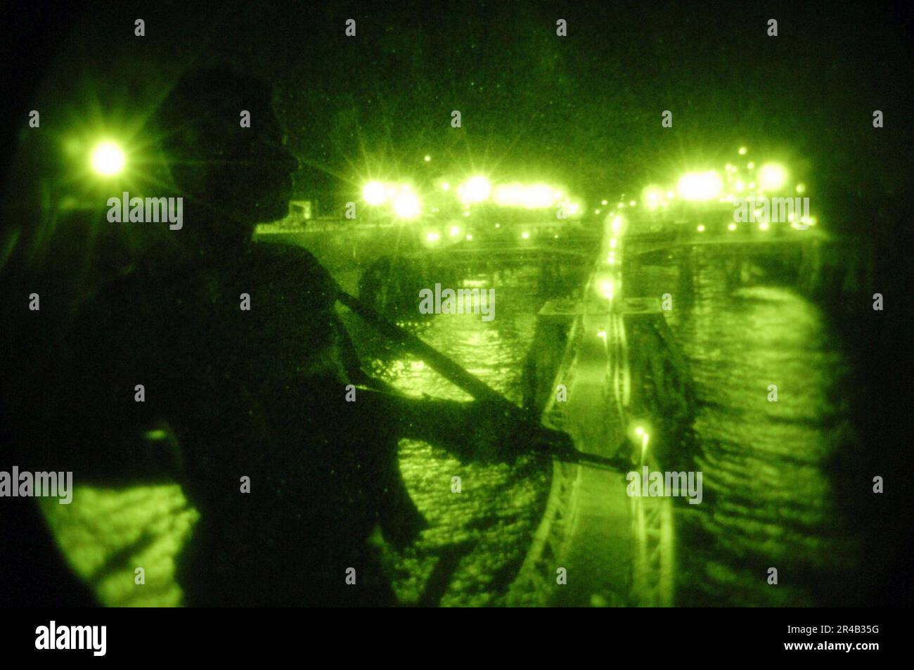 US Navy  A member of the Iraqi military stands watch on the furthest portion of the Al Basrah Oil Terminal (ABOT) at night. Stock Photo