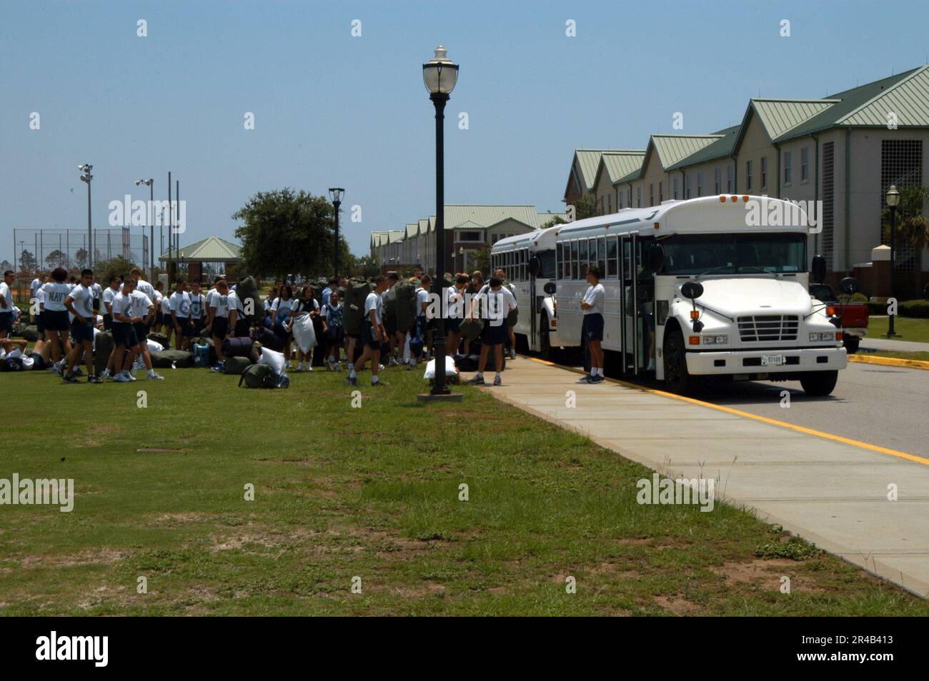 US Navy  Students assigned to Naval Aviation Technical Training Center (NATTC) load onto buses as they prepare to evacuate. Stock Photo