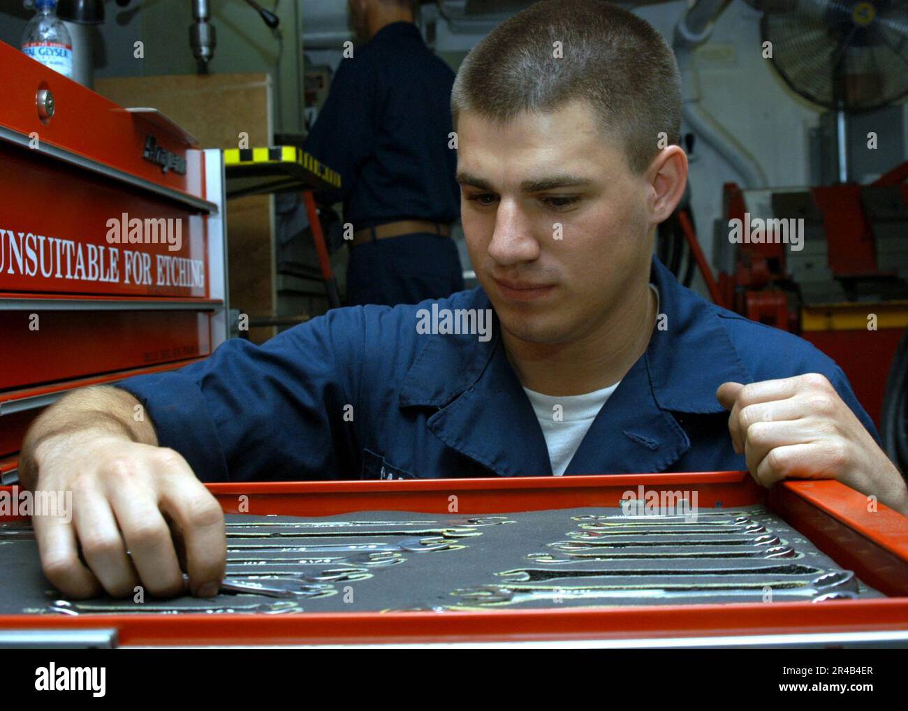 US Navy Aviation Structural Mechanic Airman counts tools during ...