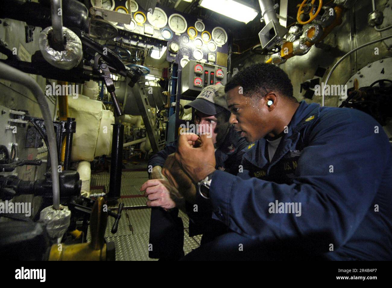 US Navy Machinist's Mate 1st Class trains Chief Engineman from Dayton