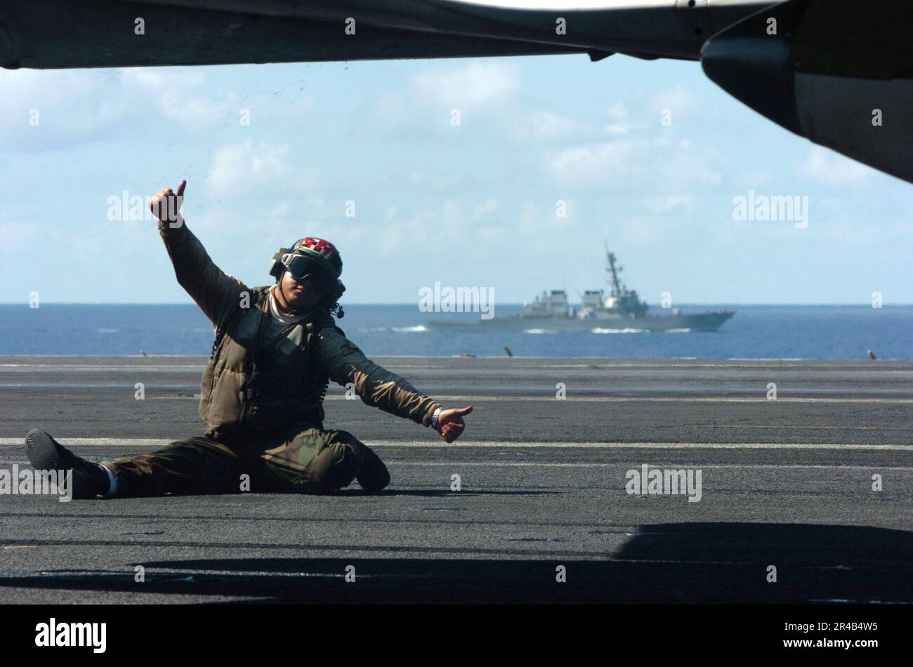 US Navy A squadron troubleshooter signals that his aircraft is ready
