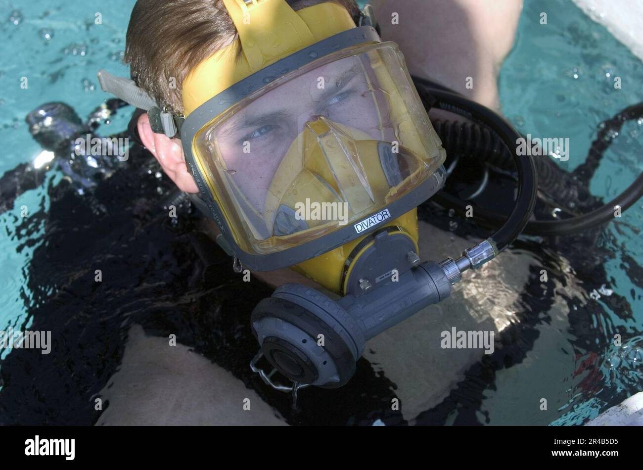 US Navy Electrician's Mate 2nd Class emerges out of the Navy Diver