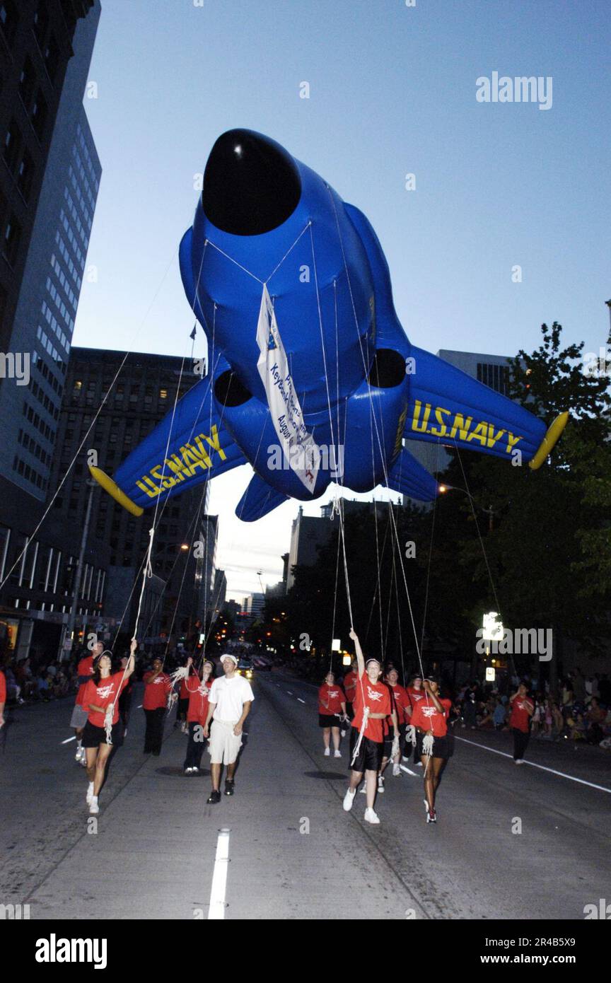 US Navy Key Bank representatives present a Blue Angels balloon at the