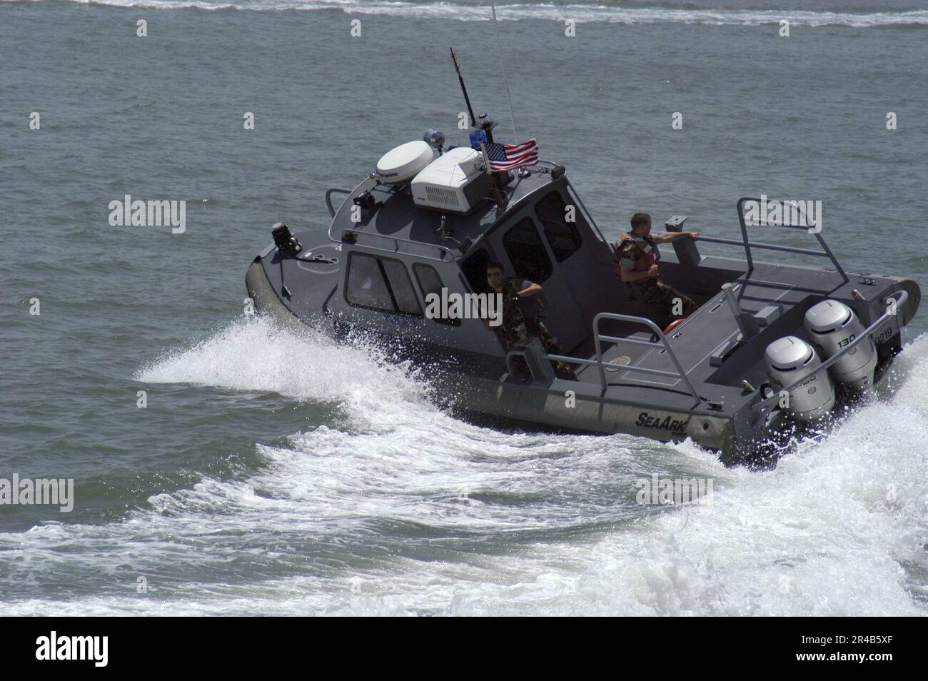 US Navy Sailors assigned to Naval Station Ingleside, Texas, make a high