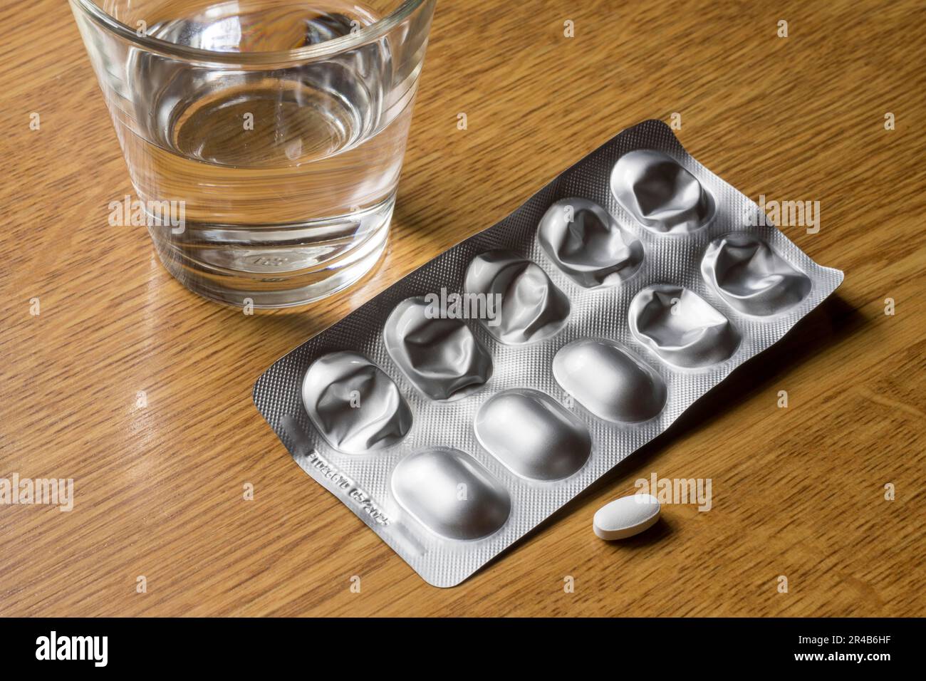 Medicines with a glass of water, tablets, blister pack Stock Photo