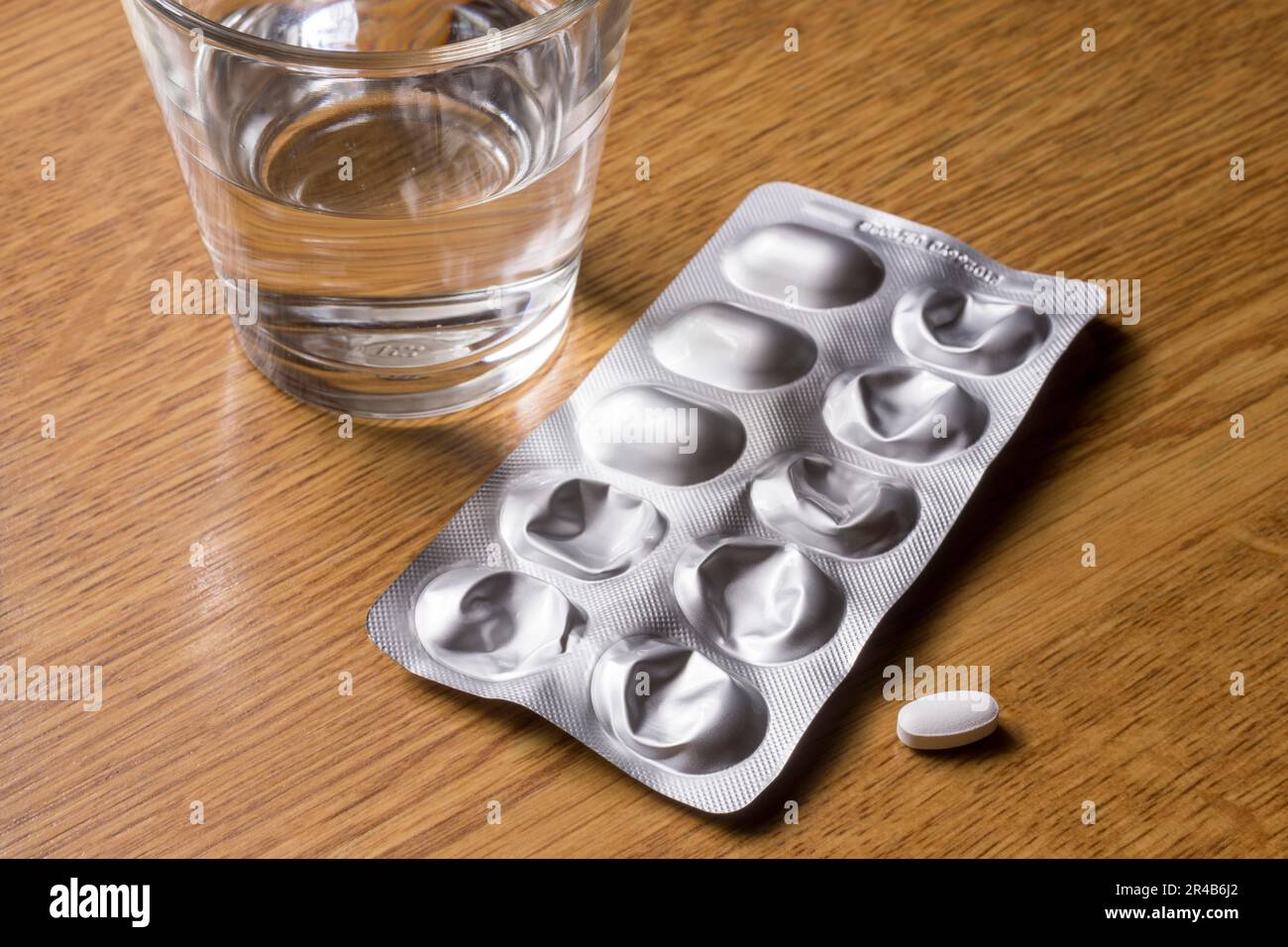 Medicines with a glass of water, tablets, blister pack Stock Photo