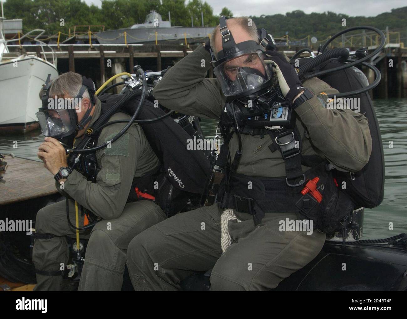 US Navy Cmdr. and Electrician's Mate 1st Class assigned to Explosive