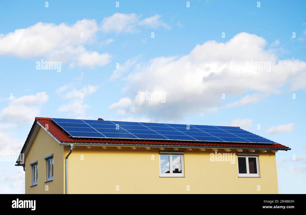 Green Energy, Electricity generation with solar panels on the roof Stock Photo