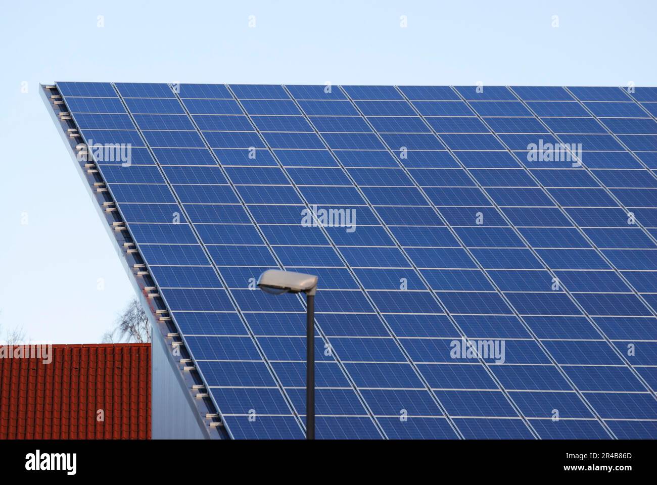 Photovoltaic, Electricity generation with solar panels on the roof Stock Photo