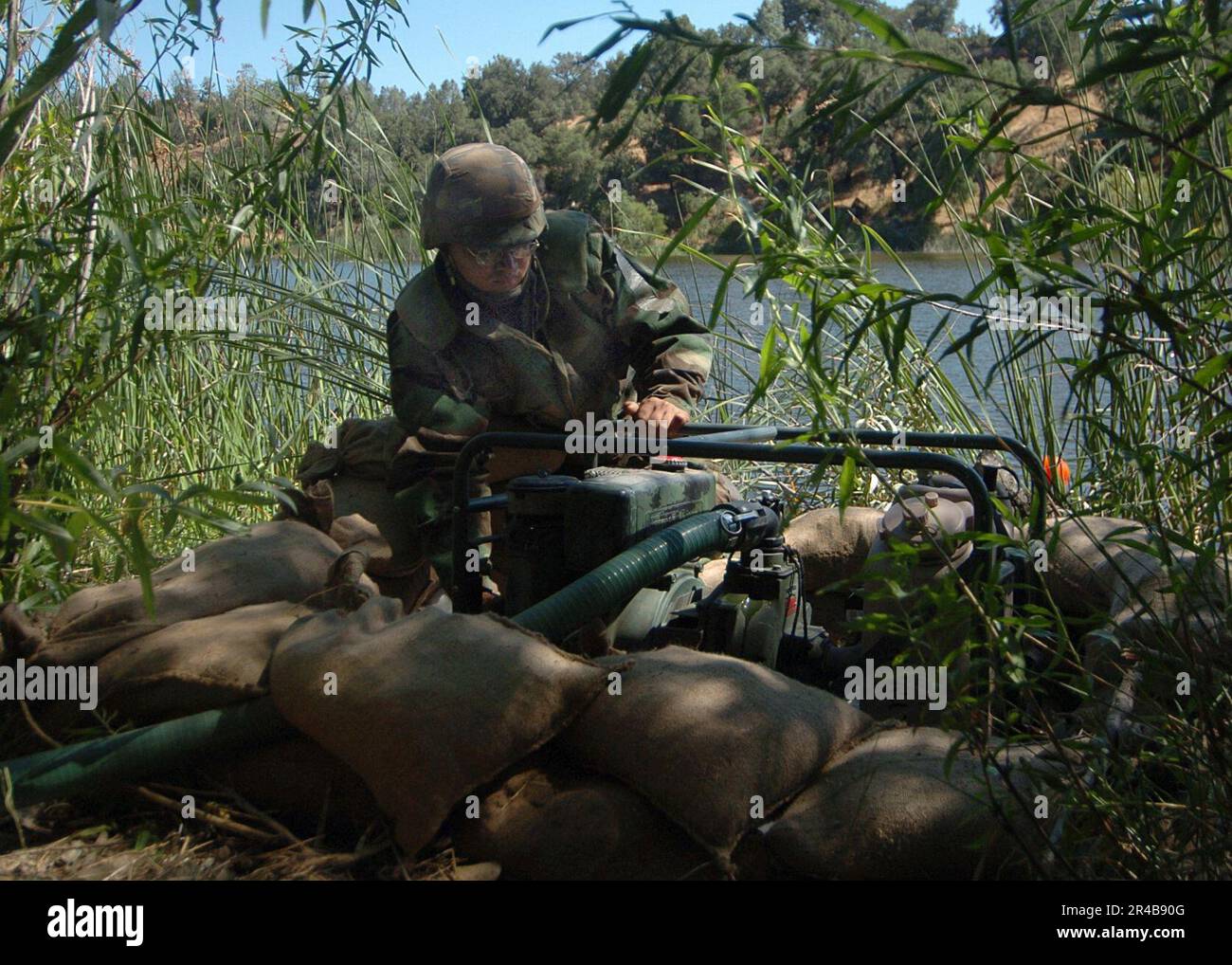 US Navy U.S. Navy Utilitiesman 3rd Class assigned to Naval Mobile Construction Battalion Two Two