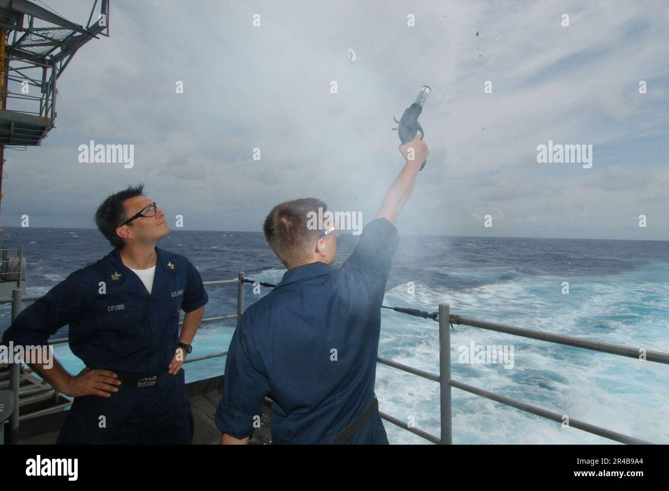 US Navy Gunner's Mate 1st Class watches as a weapons department Sailor