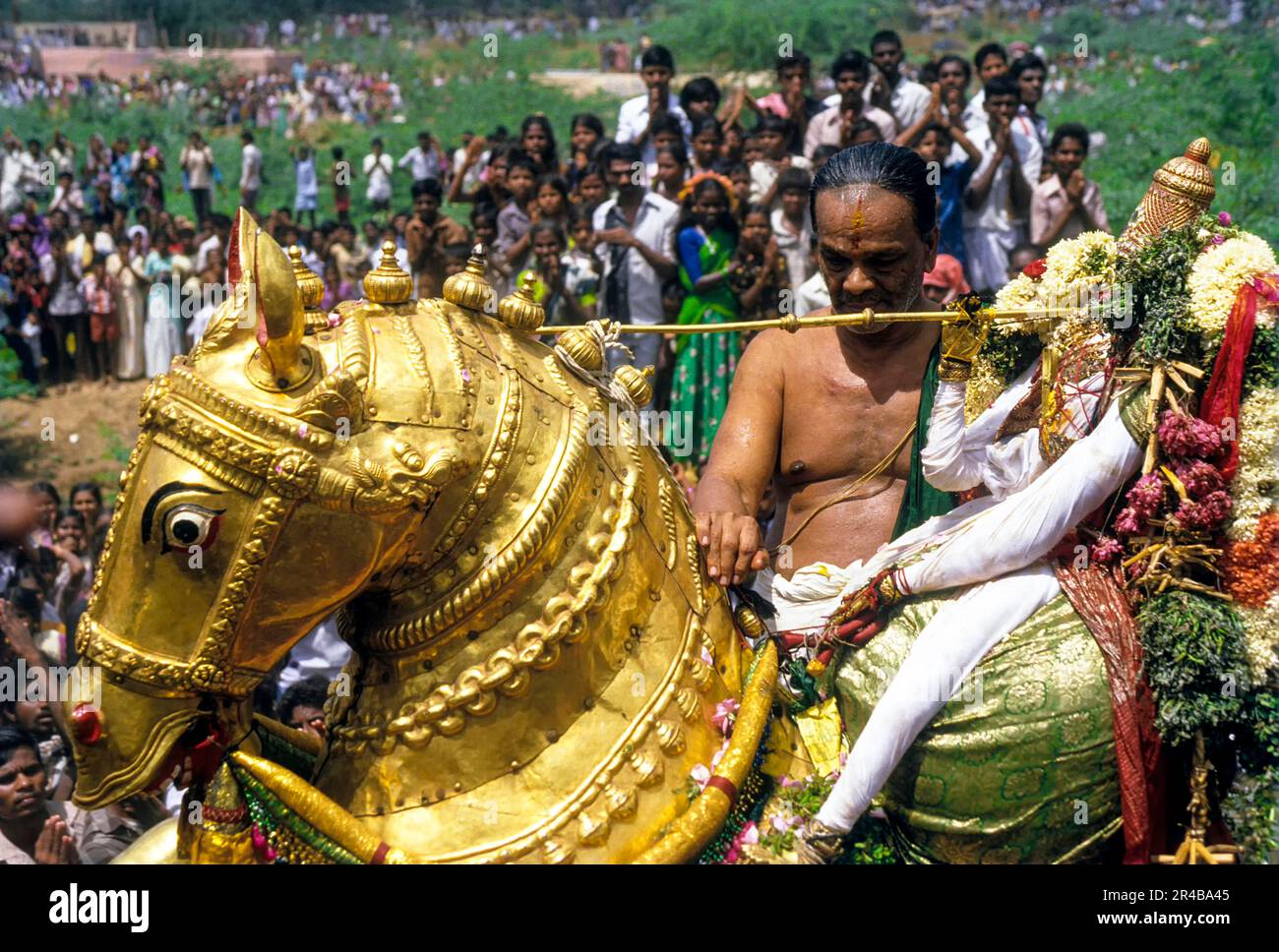 Riding the golden horse, Kallazhagar Vishnu on the bank of River Vaigai
