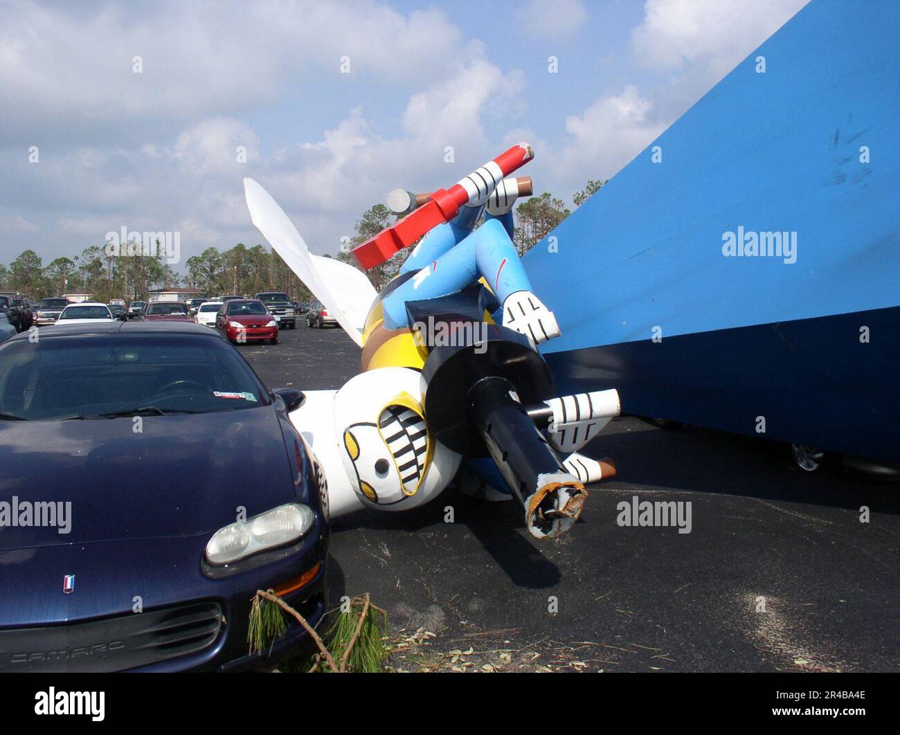 US Navy A giant Seabee statue lays in a parking lot after being blown